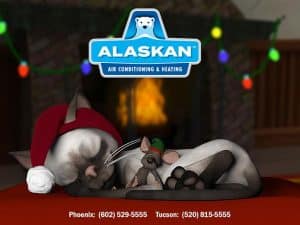 Cartoon cat and mouse sleeping together in front of fireplace with Alaskan Air Conditioning and Heating logo and contact phone numbers